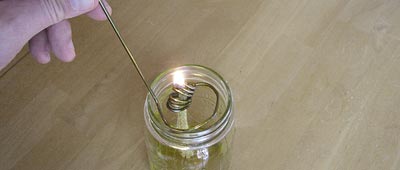 insert-wick-assembly-into-olive-oil-jar