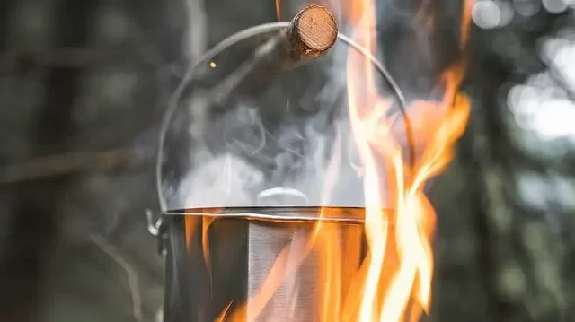 https://modernsurvivalblog.com/wp-content/uploads/2023/06/hanging-a-survival-cooking-pot-over-fire-640x359.webp
